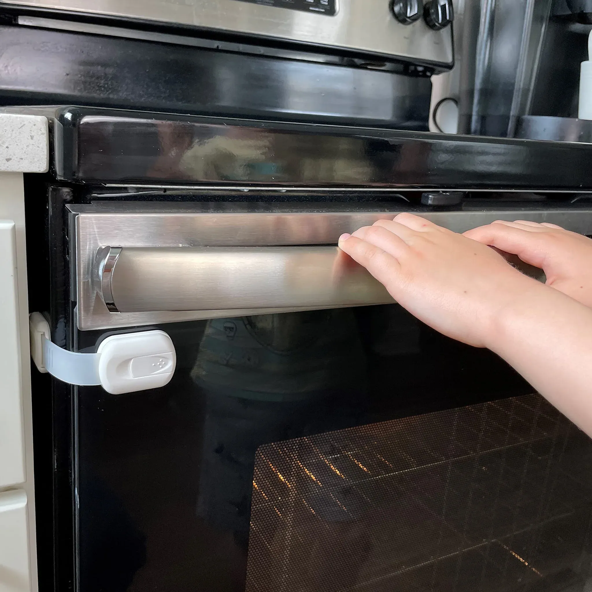 Parent installing child lock on oven