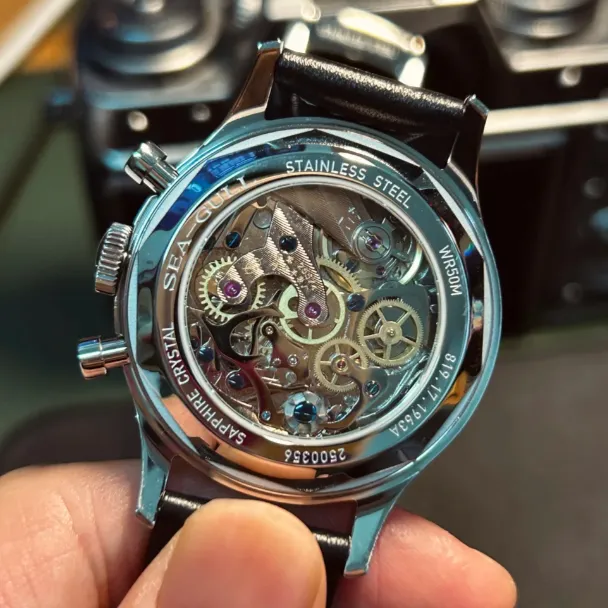 Watchmaker servicing a manual winding watch