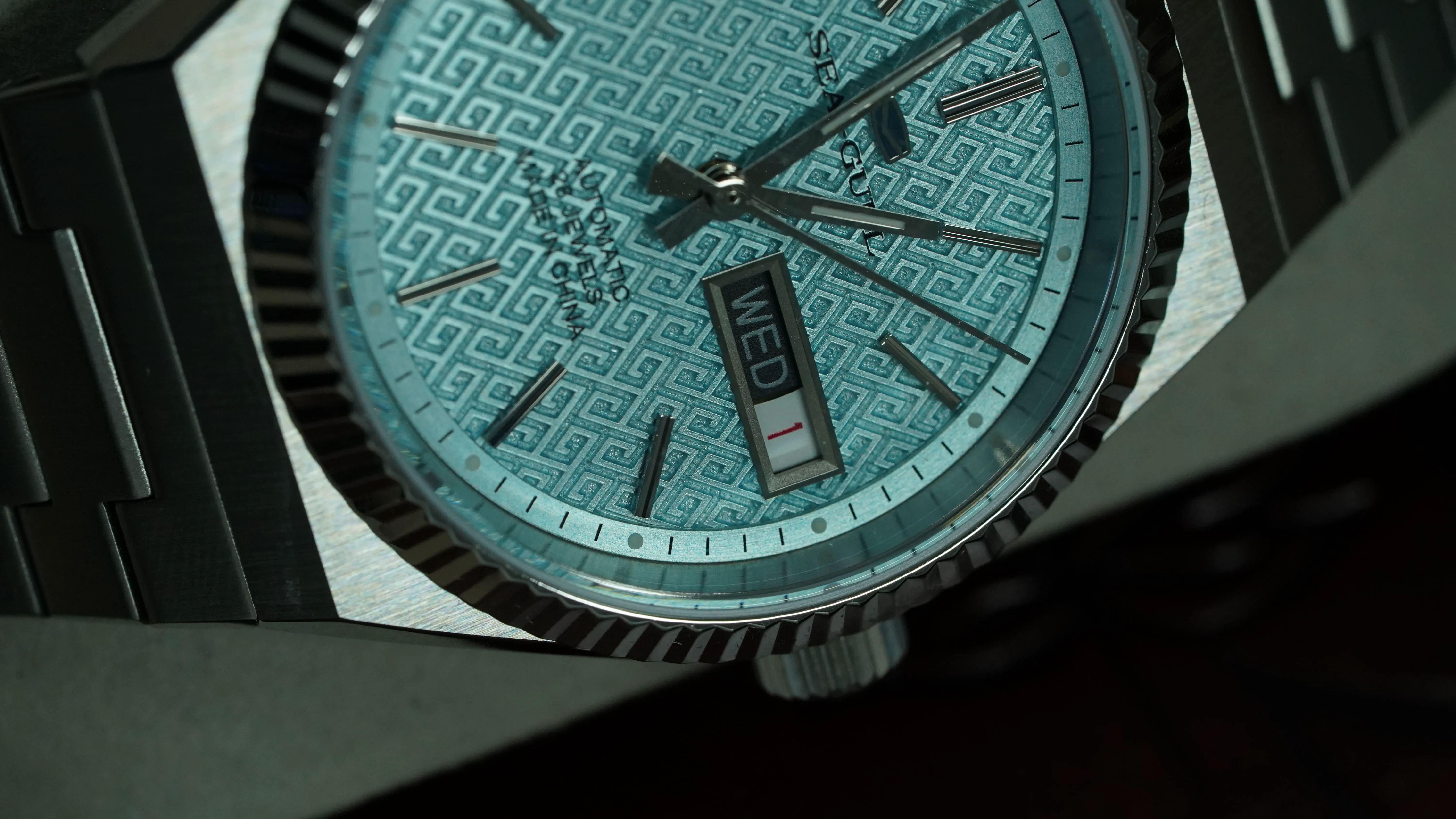 Fluted bezel day date watch close-up